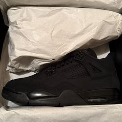 Black cat Jordan 4s 