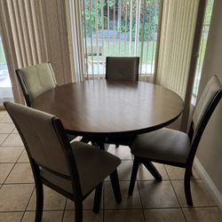 round table with 4 chairs  ( diameter 4 ft)
