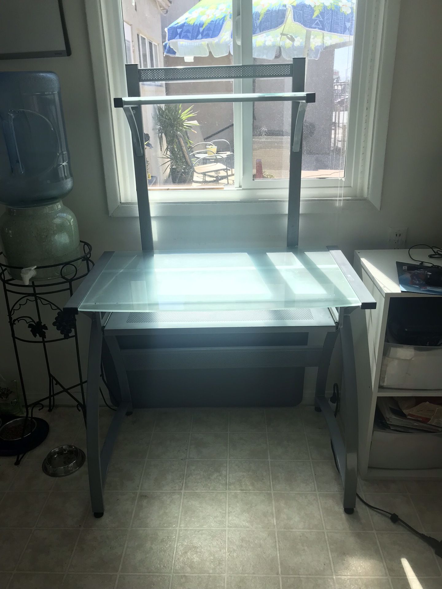 Small glass desk with keyboard drawer