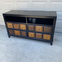 TV stand holding 60 inch TV