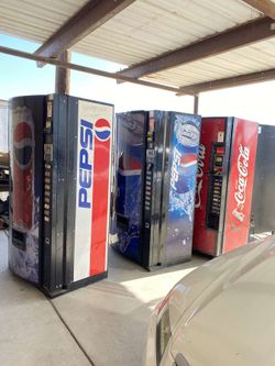 4 Soda Machines And A Snack Machine