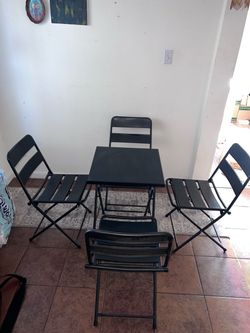Black metal table and chairs set