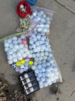 Large Lot of Used Golf Balls and Tees