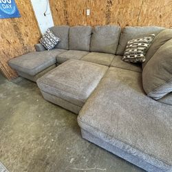 New Three Sided Large Sectional. Storage Ottoman Optional. Can Deliver.