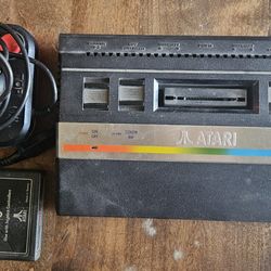 Atari 2600 console with joystick and Combat game