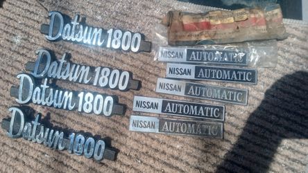 VINTAGE DATSUN NOS EMBLEMS NEW