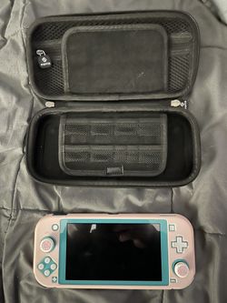 SWITCH LITE  TEAL ( Great Condition, Pink Skin Covers)