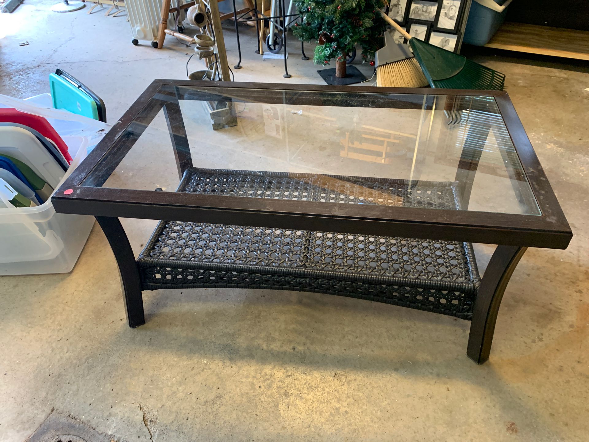 Glass top wood and wicker coffee table