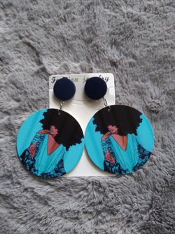 Beautiful black afro lady and multicolored earrings