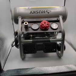 Husky 1 Gallon Portable Electric-Powered Silent Air Compressor. It is designed for small DIY projects and home improvement tasks. It features a 1/2 HP