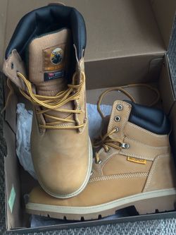 Defender men's wheat work boots in size 9XW.   Excellent condition   The boots feature waterproof leather and a slip-resistant sole.They are designed 