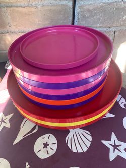 Vintage  Heller Rainbow Dinner Plates designed by Massimo Vignelli, featuring a vibrant stack of colorful melamine plates.