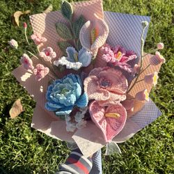Crochet pink puppy and blue peony bouquet