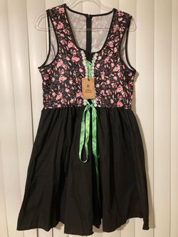 Black dirndl-style dress Size Large featuring a pink floral bodice and a bright green ribbon