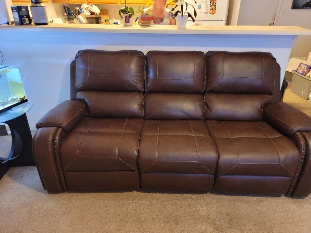 Brown leather sofa and loveseat  recliner with USB insured for 5 years