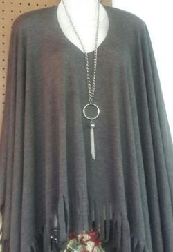 Grey fringe poncho with silver necklace