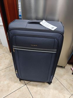 blue Samsonite Silhouette 18 27" checked luggage bag featuring 360-degree spinner wheels.
