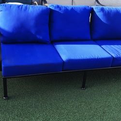 $1200 BIG ARIZONA IRON 3 SEATER COUCH AND 2 TABLES 