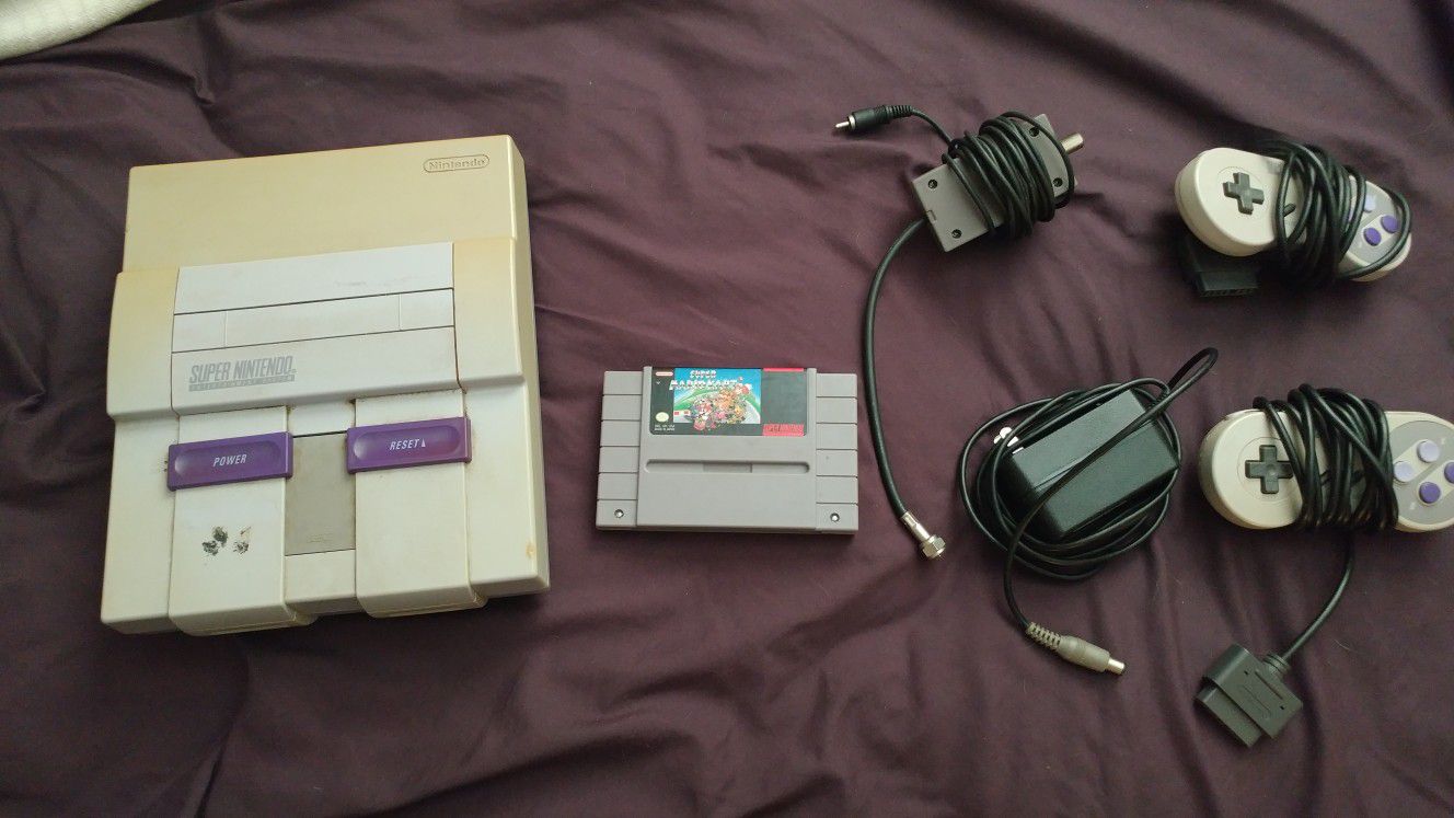 Super Nintendo with Mario kart and 2 controllers