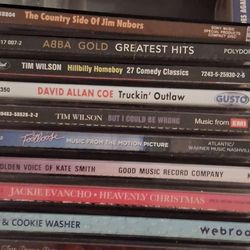 Assorted cassette tapes and cds
