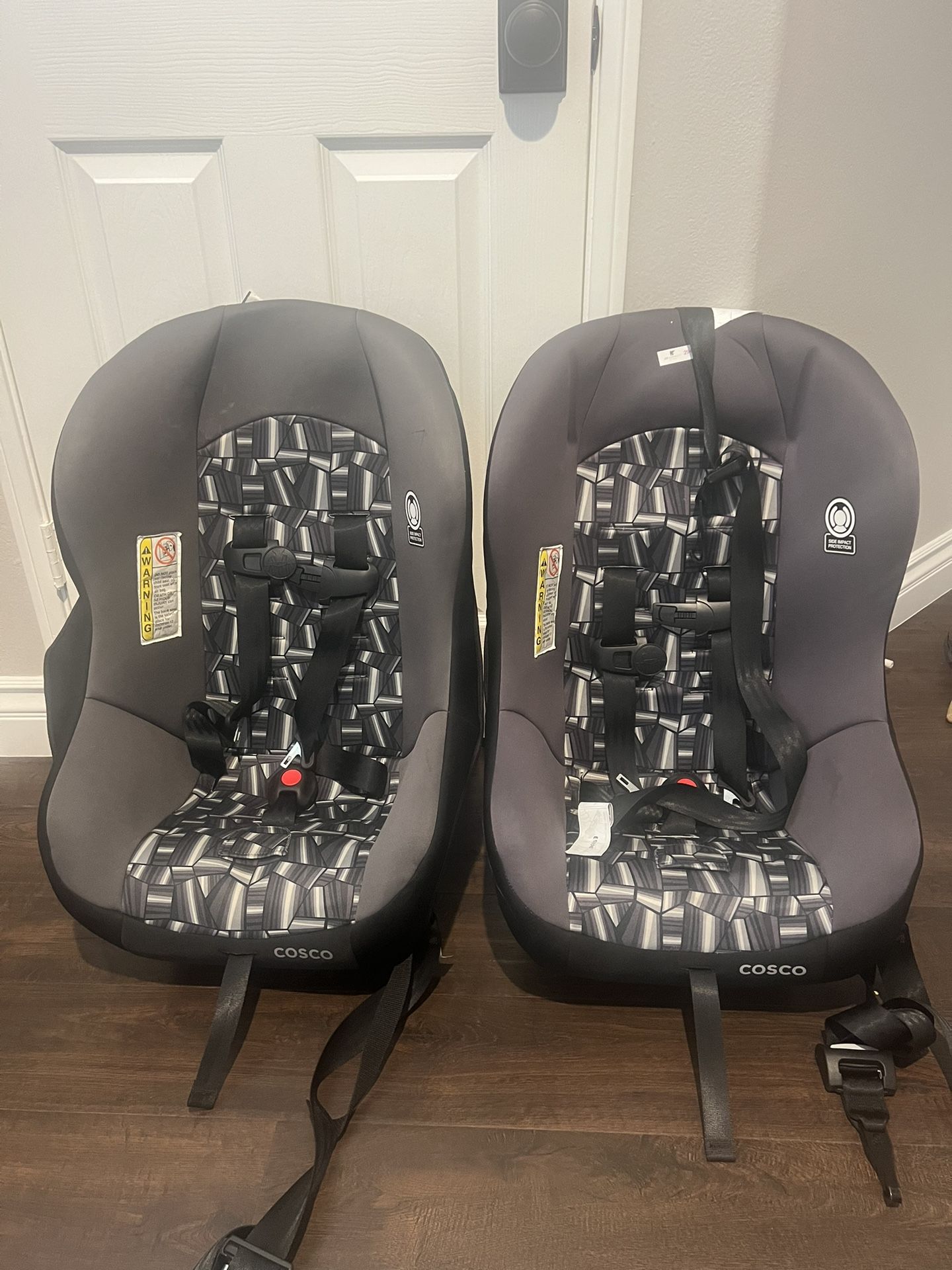 Two Cosco Travel Car Seats