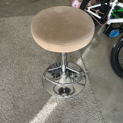 Brown spinning bar stool