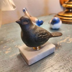 Black Cast Iron Bird Sculpture on White Marble