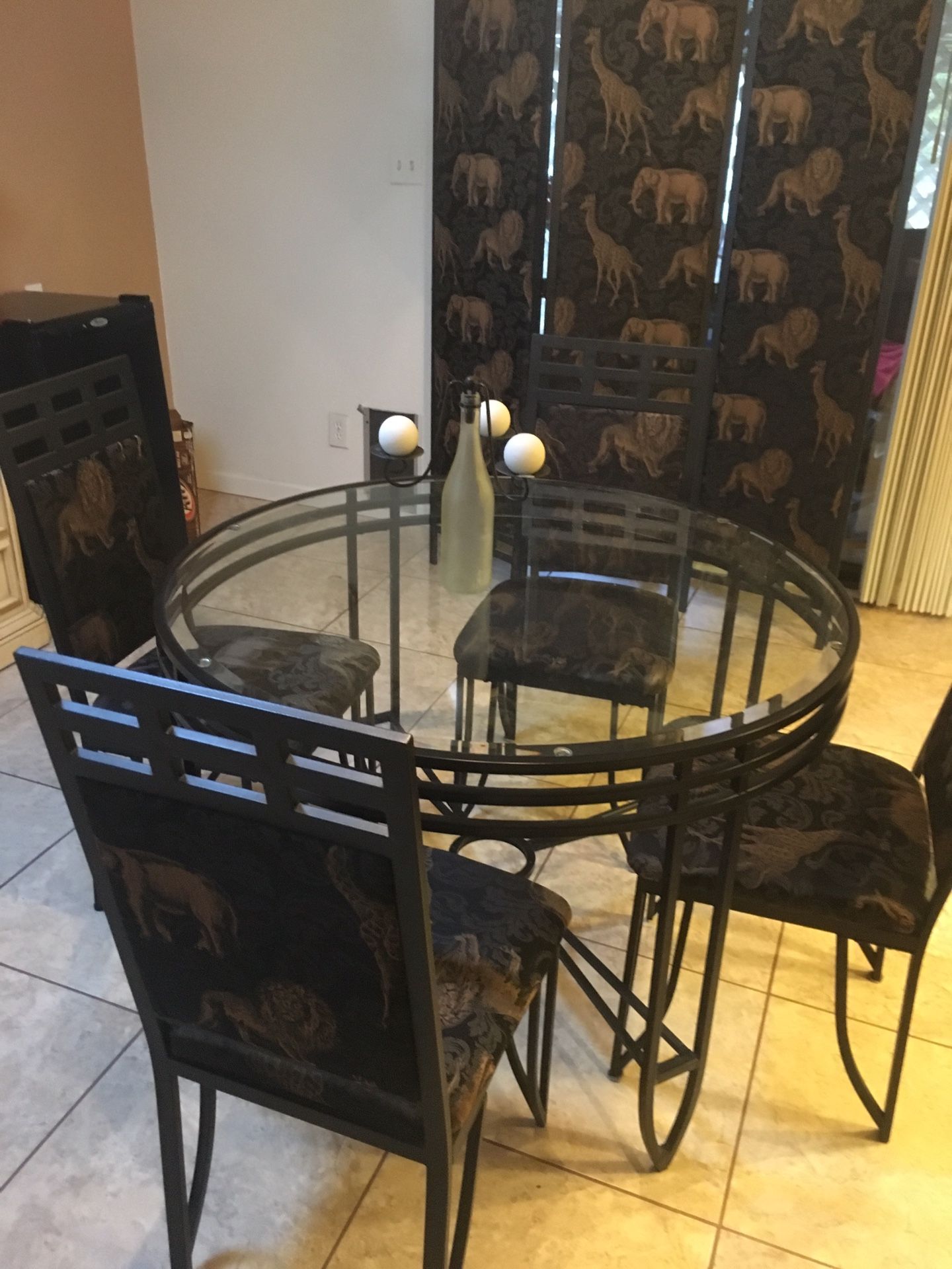 Safari/animal print room partition, 42” glass table and 4 chairs.