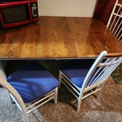 4 Chairs And Solid Table