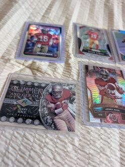 Niners Collection: in cases- Deebo Rookie cards, Jerry Rice cards and Montana and Purdy
