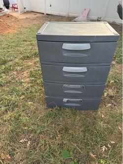 A nice grey storage with 4 draws (35” tall x 25” long x 18” wide) the 2 bottom draws handles are a little damage