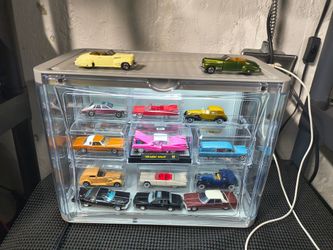 Toy Cadillac cars with lighted display case