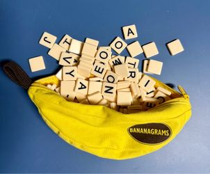 Bananagrams Classic Word Game - Fast-Paced Spelling & Anagram, Family & Travel Game, 144 Letter Tiles in Portable Banana Pouch, 1-8 Players, Education
