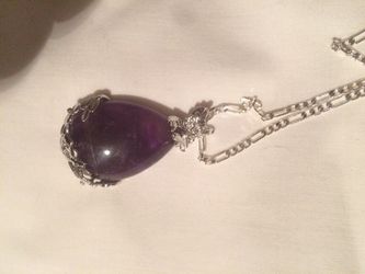 Purple pendant on silver chain