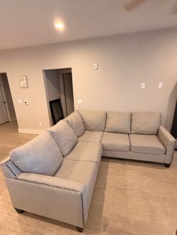 Light grey L shaped sofa sectional with dark feet