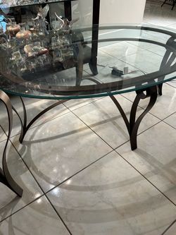 Glass and metal sofa and side table