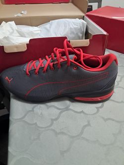Gray and red puma shoes size 11
