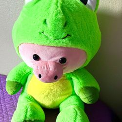 Stuffed animal pig in frog suit 