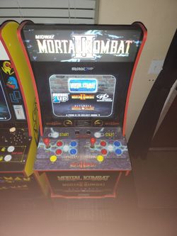 Pac-Man and Mortal Combat arcade machines with raiser