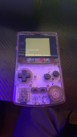 Game boy color/clear purple and comes with Pokémon trading card game
