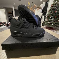 Black cat jordan 4s
