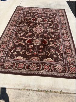 Brown, red and cream floral rug