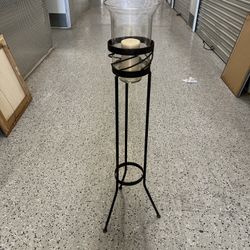 Wrought iron candle holder with hurricane glass