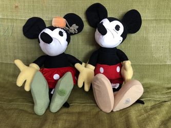 Vintage Mickey and Minnie Mouse stuffed dolls.