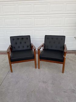 Set of 2 black faux leather accent chairs with wooden arms & legs