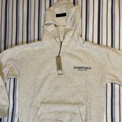 Essentials Fear of God hoodie in a neutral heather oatmeal/cream color 🤍