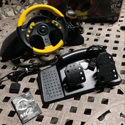 PlayStation 2, XBOX, GameCube, PS One & Playstation COMPATIBLE MADCATZ MC2 UNIVERSAL STEERING WHEEL and PEDALS