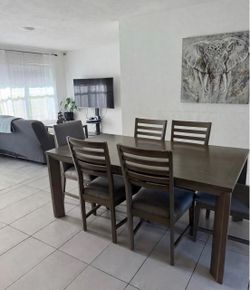 Title: 6 Chair Dining Set + Table - Gray Fabric - 1 Chair Has Paint Chip (See Pics)