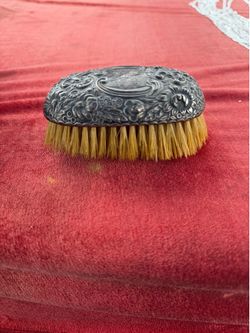 Antique sterling silver stamped brush with flower engraving