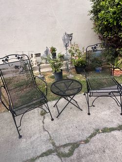 Floral iron & metal chairs with small table